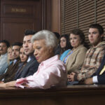 jurors sitting in jury box of a courtroom