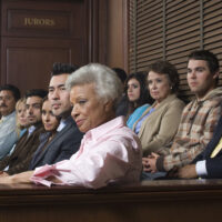 jurors sitting in jury box of a courtroom