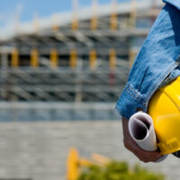 Construction Worker with helmet at work Site