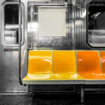 New York City subway car interior with colorful seats