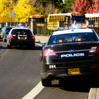 Police cars and school buses