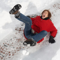 woman slipping on black ice