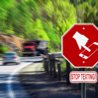 stop-texting-sign-with-a-car