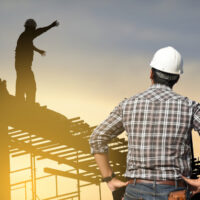 worker on top of a roof