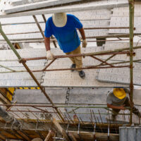 two workers on scaffold