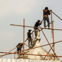 construction workers on a scaffold