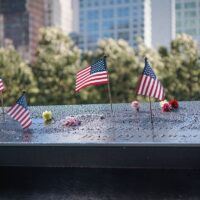 National September 11 Memorial, american flag, flowers, names, New York, USA