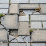 Damaged gray sidewalk tiles needing repair, sidewalk, broken, damaged, repair, outdated, perspective, paving