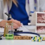 A skilled medical professional examines a patient for ileus signs using images, a stethoscope, and medications A skilled medical professional examines a patient for ileus signs using images, a stethoscope, and medications