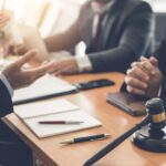 Businessman and lawyer discuss lawsuits in the office. Businessman and lawyer discuss lawsuits in the office.