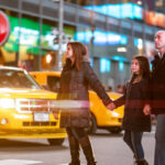 Family crossing Broadway in Times Square, New York City Family crossing Broadway in Times Square, New York City
