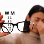 Vision disorder - vision problems - blurred vision. Young woman with glasses. Vision disorder - vision problems - blurred vision. Young woman with glasses.