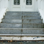 damaged stairway to door