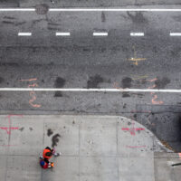 View of from above of urban street in New York City Manhattan car and pedestrians View of from above of urban street in New York City Manhattan car and pedestrians