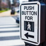 Push button to cross road crosswalk sign