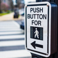 Push button to cross road crosswalk sign