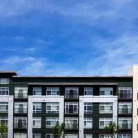 Modern apartment buildings on a sunny day with a blue sky Modern apartment buildings on a sunny day with a blue sky